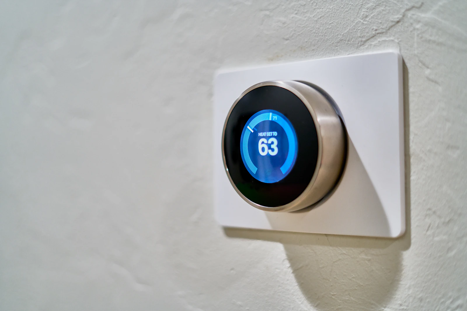 Smart thermostat on a home wall