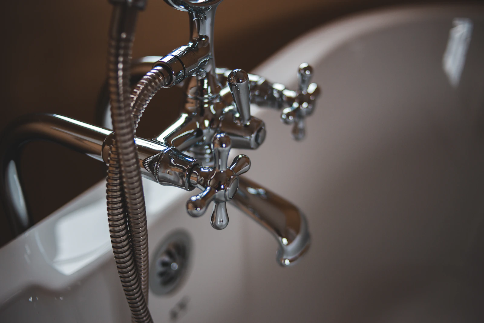 Polished faucet and tub in a finished bathroom