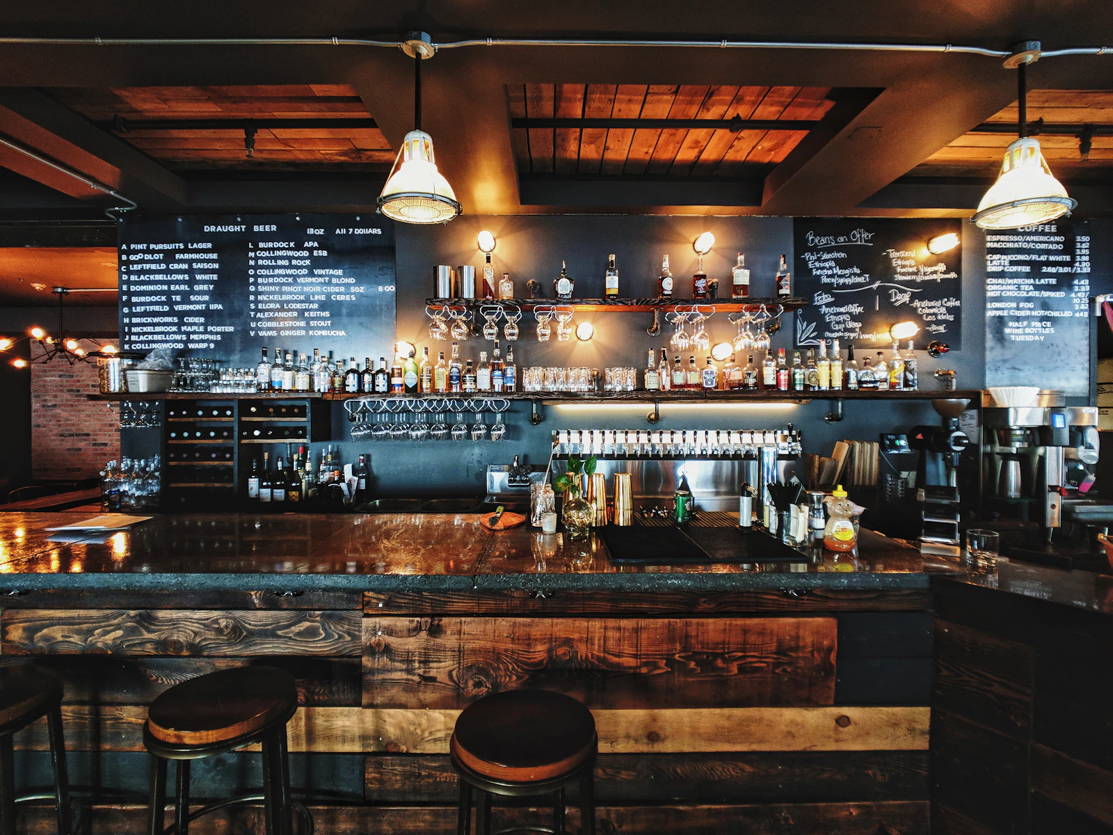 Warmly lit bar with chalkboard menus